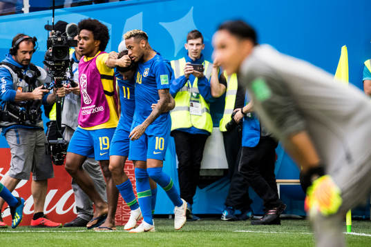 Philippe Coutinho of Brazil celebrates with his teammates