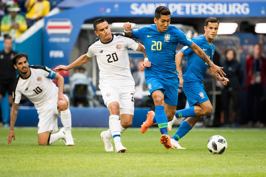 David Guzman of Costa Rica and Roberto Firmino of Brazil