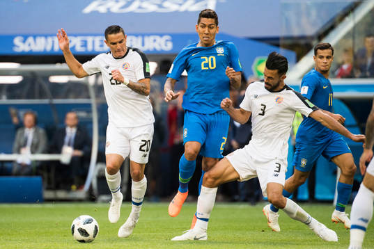 Roberto Firmino of Brazil against David Guzman and
