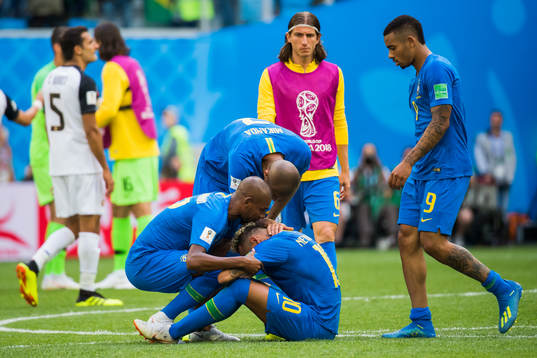 Neymar of Brazil celebrates with his teammates