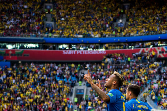 Neymar of Brazil celebrates with his teammates