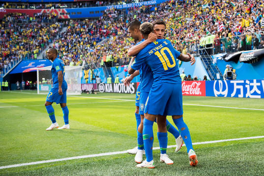 Neymar of Brazil celebrates with his teammates