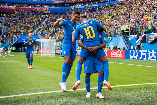 Neymar of Brazil celebrates with his teammates