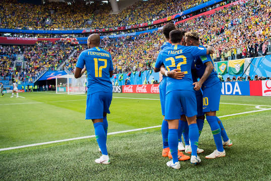 Neymar of Brazil celebrates with his teammates