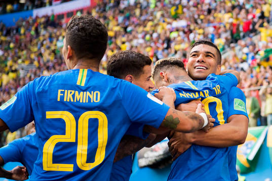 Neymar of Brazil celebrates with his teammates