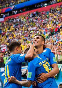Neymar of Brazil celebrates with his teammates