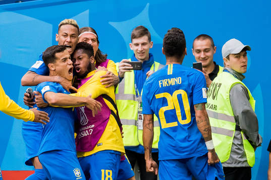 Philippe Coutinho of Brazil celebrates with his teammates