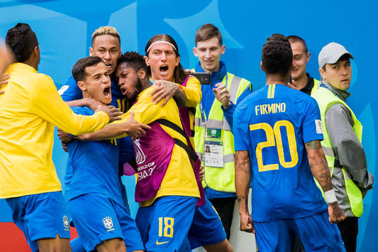 Philippe Coutinho of Brazil celebrates with his teammates