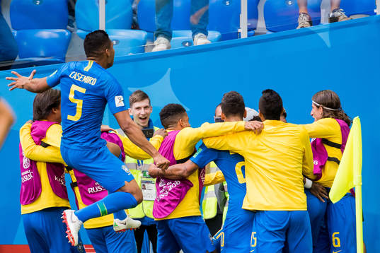 Philippe Coutinho of Brazil celebrates with his teammates
