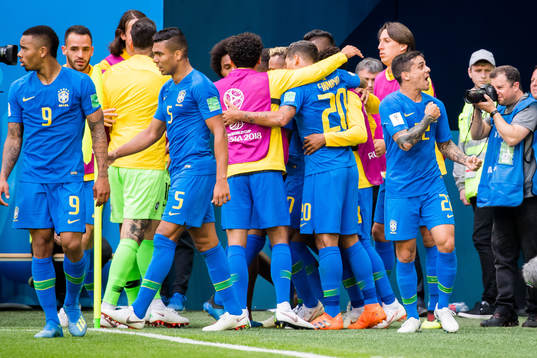 Philippe Coutinho of Brazil celebrates with his teammates