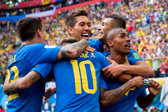 Neymar of Brazil celebrates with his teammates