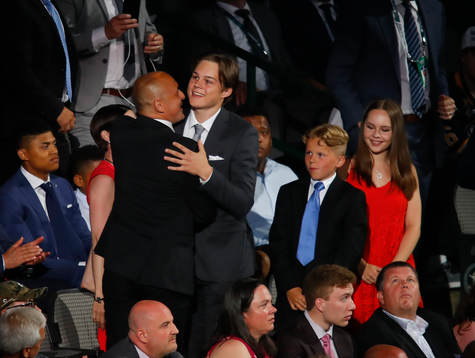 Rasmus Kupari of Finland hugs his family