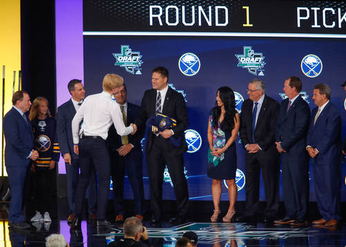 Rasmus Dahlin of Sweden shakes hands with team