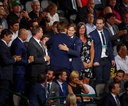 Adam Boqvist of Sweden hugs his family