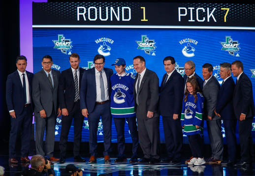 Quintin Hughes of the United States poses with team