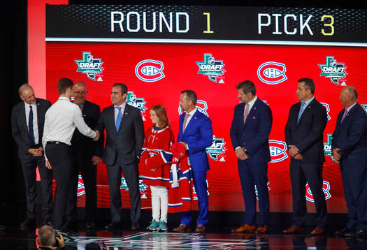 Jesperi Kotkaniemi of Finland shakes hands with team