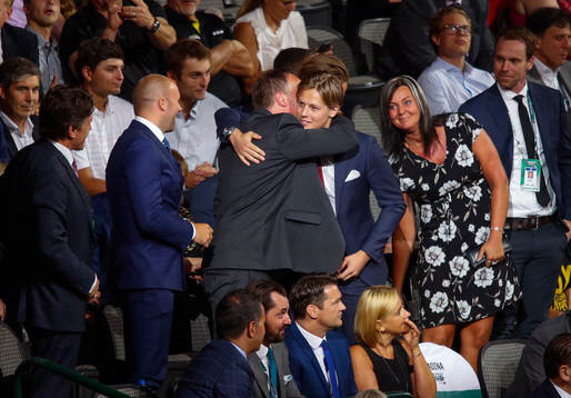 Adam Boqvist of Sweden hugs his family