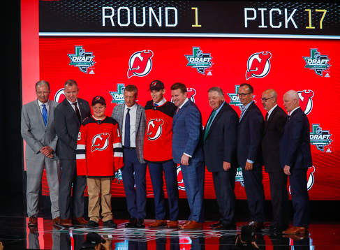 Ty Smith of the United States poses with team