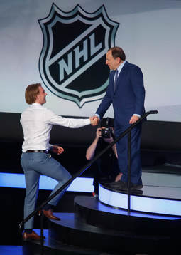 Rasmus Sandin is greeted by NHL Commissioner Gary Bettman