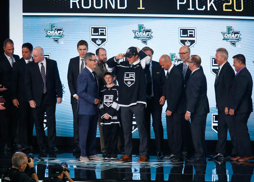 Rasmus Kupari of Finland poses with team representatives