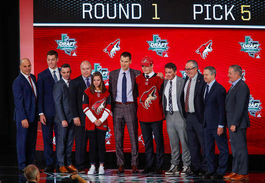 Barrett Hayton of Canada poses with team representatives