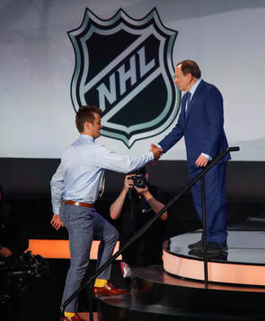 Oliver Wahlstrom of the United States is greeted by NHL