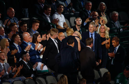 Rasmus Dahlin of Sweden hugs his family