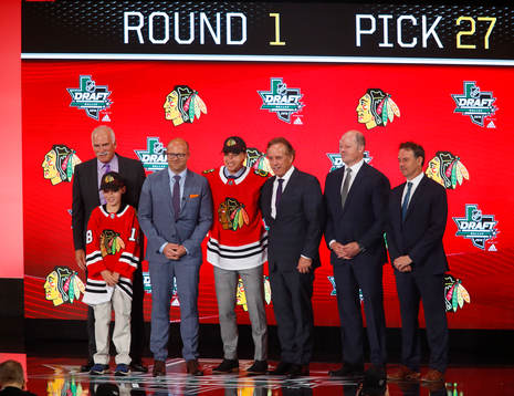 Nicolas Beaudin of Canada poses with team representatives