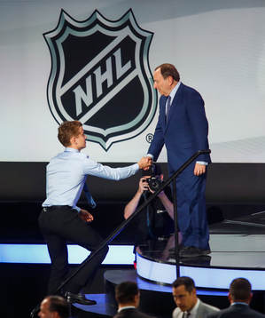Nils Lundkvist of Sweden is greeted by NHL Commissioner