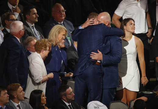 Brady Tkachuk hugs his father and U.S. Hockey Hall of Fame