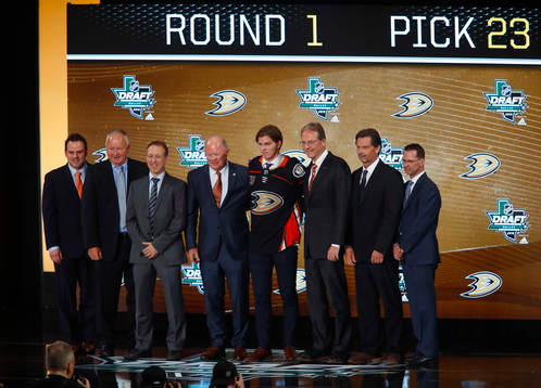 Isac Lundestrom of Sweden poses with team representatives