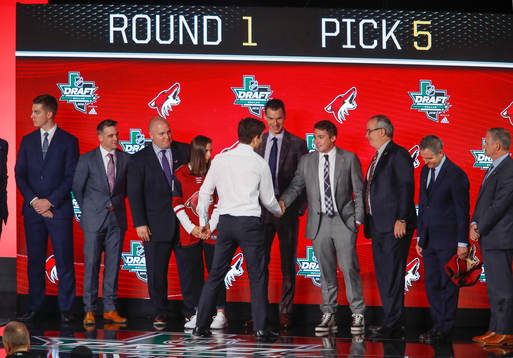 Barrett Hayton of Canada shakes hands with team