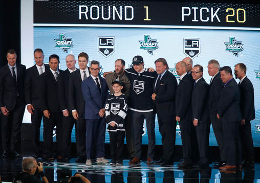 Rasmus Kupari of Finland poses with team representatives
