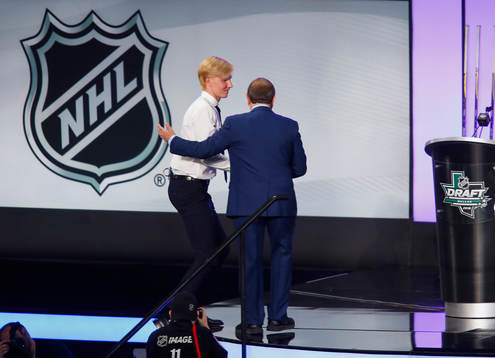 Rasmus Dahlin of Sweden s greeted by NHL Commissioner Gary