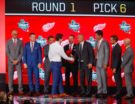 Filip Zadina of Canada shakes hands with team