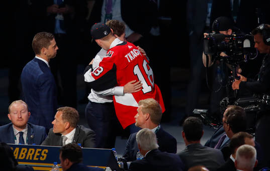 Quintin Hughes of the United States is hugged by 4th