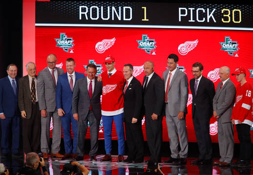 Joseph Veleno of Canada poses with team representatives