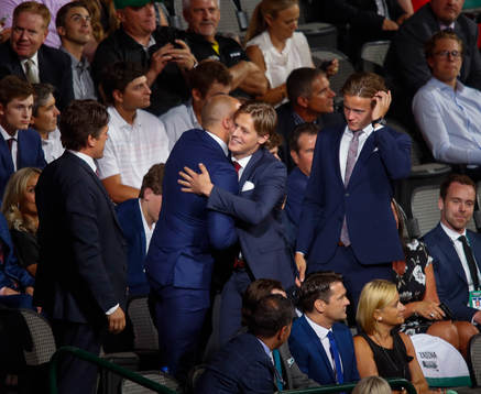 Adam Boqvist of Sweden hugs his family