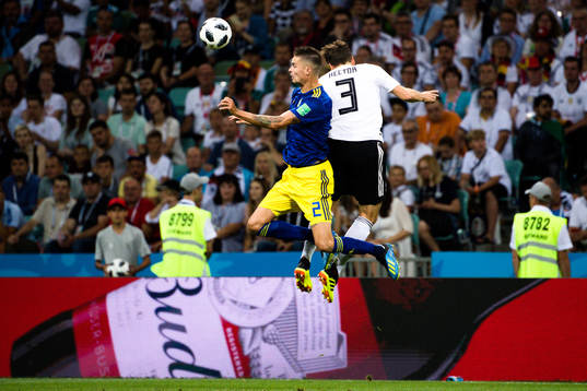 Mikael Lustig of Sweden and Jonas Hector of Germany