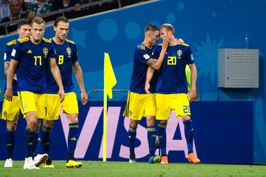 Mikael Lustig and Ola Toivonen of Sweden celebrates the 1-0