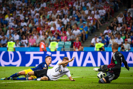 Thomas Müller of Germany against Mikael Lustig and