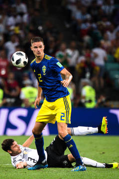Jonas Hector of Germany and Mikael Lustig of Sweden