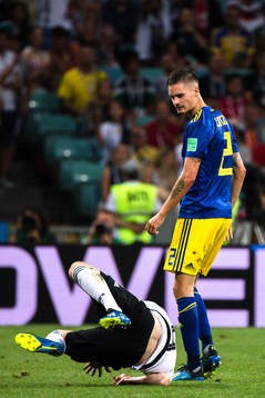 Timo Werner of Germany and Mikael Lustig of Sweden