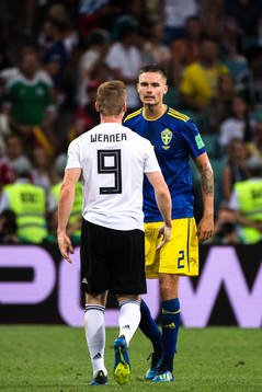 Timo Werner of Germany and Mikael Lustig of Sweden