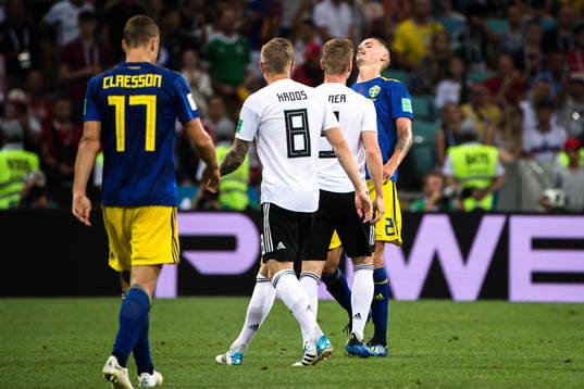 Timo Werner of Germany and Mikael Lustig of Sweden