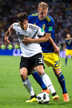 Jonas Hector of Germany and Ola Toivonen of Sweden