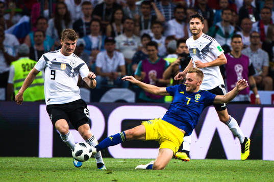 Timo Werner of Germany and Sebastian Larsson of Sweden