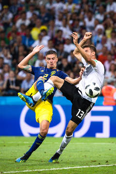 Mikael Lustig of Sweden and Thomas Müller of Germany