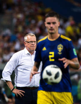 head coach Janne Andersson and Mikael Lustig of Sweden