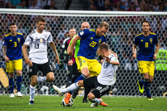 Ola Toivonen of Sweden and Joshua Kimmich of Germany